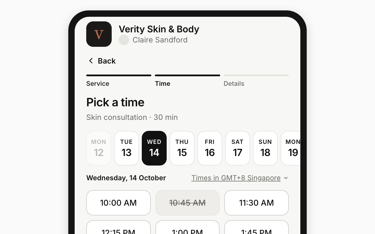 A phone showing the public booking page's Pick a time step