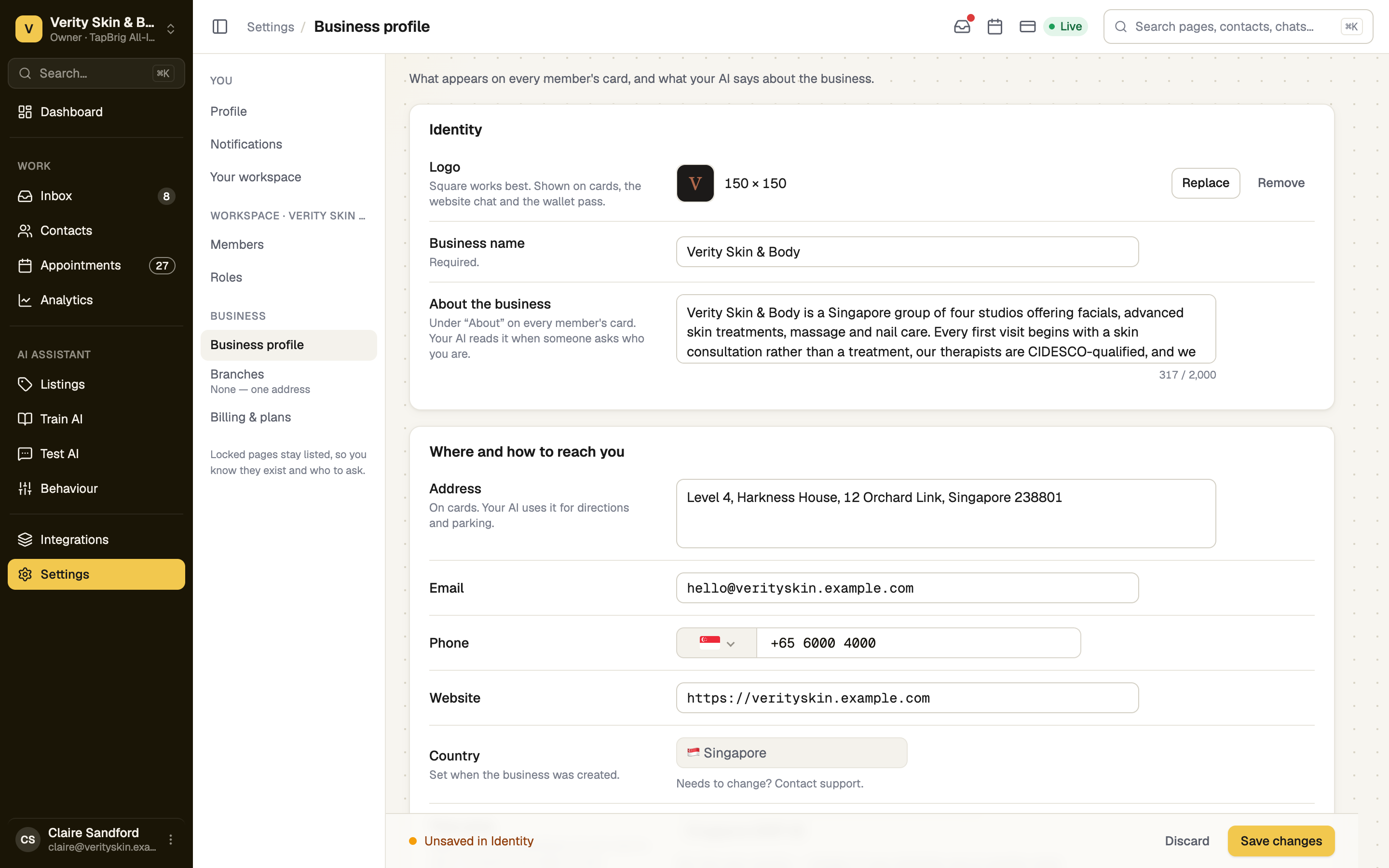 Business profile page with identity, contact fields and Save changes bar